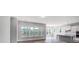 Bright, open-concept living space boasting luxury vinyl plank flooring and many windows at 552 Fern Hill Rd # 21, Mooresville, NC 28117