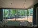 View from the covered porch showcasing wooded backyard in a construction phase at 552 Fern Hill Rd # 21, Mooresville, NC 28117