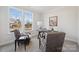 Bright home office features a large window, built-in desk, and comfortable seating at 219 E Warfield Dr, Mooresville, NC 28115
