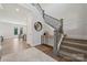 Elegant staircase with wrought iron railing and neutral color palette at 219 E Warfield Dr, Mooresville, NC 28115