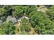 Aerial view of the home showcasing mature trees, roof, and surrounding neighborhood at 1003 Woodland Dr, Gastonia, NC 28054