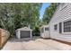 View of side yard and detached garage, providing ample space for parking or storage at 1003 Woodland Dr, Gastonia, NC 28054