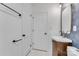 Bathroom showcasing modern vanity with a sink, stylish wallpaper and white marble floors at 1003 Woodland Dr, Gastonia, NC 28054