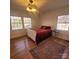 Well-lit bedroom with hardwood floors and windows at 1003 Woodland Dr, Gastonia, NC 28054