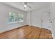 Bright bedroom with hardwood floors, windows, and white trim at 1003 Woodland Dr, Gastonia, NC 28054