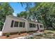 Exterior view of home with tidy landscaping and a freshly mulched garden and walkway at 1003 Woodland Dr, Gastonia, NC 28054