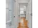 Hallway view showcasing the bathroom and kitchen and the beautiful hardwood floors at 1003 Woodland Dr, Gastonia, NC 28054