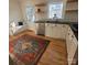 Charming kitchen with stainless steel appliances, floating shelves, and a window seat at 1003 Woodland Dr, Gastonia, NC 28054