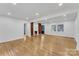 Bright and spacious living room featuring hardwood floors, fireplace and a large window at 1003 Woodland Dr, Gastonia, NC 28054