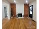 Stylish living room with hardwood floors, fireplace, and modern decor at 1003 Woodland Dr, Gastonia, NC 28054