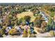 Aerial view of a home situated near a golf course with mature trees and manicured lawns at 15909 Woodcote Dr, Huntersville, NC 28078