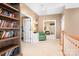 Hallway featuring a bookshelf and view of living area at 15909 Woodcote Dr, Huntersville, NC 28078