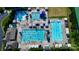 Aerial shot of sparkling community pools with ample seating, including a slide at 15909 Woodcote Dr, Huntersville, NC 28078