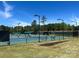 Outdoor tennis courts provide ample space for sports and recreation in the community at 15909 Woodcote Dr, Huntersville, NC 28078