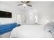 Bright bedroom featuring a bed, blue dresser, and ample natural light, creating a serene and inviting space at 2107 W Trade St, Charlotte, NC 28216