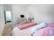 Bright bedroom featuring pink accents, a dresser with monitor, and plenty of natural light at 2107 W Trade St, Charlotte, NC 28216