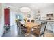 Elegant dining room featuring a rustic wooden table, stylish chairs, and modern light fixture at 2107 W Trade St, Charlotte, NC 28216