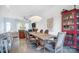 Dining area with a farmhouse table, modern decor, and seamless flow into the living space at 2107 W Trade St, Charlotte, NC 28216