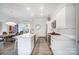 Modern kitchen with white cabinets, stainless steel appliances, and an open layout for entertaining at 2107 W Trade St, Charlotte, NC 28216