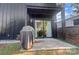 Private patio area featuring a covered grill and sliding glass doors into the home at 2107 W Trade St, Charlotte, NC 28216