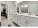 Bright bathroom with double sinks, ample cabinet space, and modern fixtures at 2413 Riparian Way, Denver, NC 28037