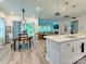 Open concept dining area adjacent to the kitchen with a view of the living room at 2413 Riparian Way, Denver, NC 28037