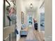 Welcoming entryway with wood floors, bench, and a view into the home at 2413 Riparian Way, Denver, NC 28037