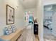 Bright entryway with bench and decor, leading to living areas and bedrooms at 2413 Riparian Way, Denver, NC 28037