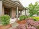 Inviting front porch with stylish columns and beautiful landscaping at 2413 Riparian Way, Denver, NC 28037