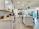 Well-lit kitchen with an island, stainless steel appliances, and open layout at 2413 Riparian Way, Denver, NC 28037