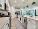 Bright kitchen featuring a center island with sink and stainless steel appliances at 2413 Riparian Way, Denver, NC 28037