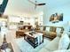 Open-concept living room and kitchen offer modern design and plenty of natural light at 2413 Riparian Way, Denver, NC 28037