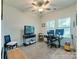 Bright office space with a ceiling fan and natural light, offering a comfortable work environment at 2413 Riparian Way, Denver, NC 28037