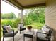 Inviting outdoor patio with comfortable seating, perfect for relaxing and enjoying the landscaped backyard at 2413 Riparian Way, Denver, NC 28037