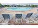 Community pool with lounge chairs, offering a refreshing and relaxing outdoor space for residents at 2413 Riparian Way, Denver, NC 28037