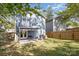 Fenced backyard with patio, pergola, and grill at 4114 Rutgers Ave, Charlotte, NC 28206