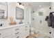 Modern bathroom with double vanity, quartz countertop, and glass shower at 4114 Rutgers Ave, Charlotte, NC 28206