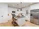 Modern kitchen with white cabinetry, stainless steel appliances, and an island at 4114 Rutgers Ave, Charlotte, NC 28206