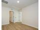 Bright hallway with laminate floors and multiple doorways to other rooms at 10103 Mamillion Dr, Huntersville, NC 28078