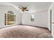 Bright bedroom with large windows offering natural light, a vaulted ceiling, and neutral carpet at 2511 Old Pond Dr, Lincolnton, NC 28092