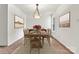 Bright dining room features wood table and chairs, modern lighting, and elegant decor at 2511 Old Pond Dr, Lincolnton, NC 28092