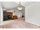 Open-concept living space featuring a kitchen island, wood cabinetry, and seamless transitions to a dining area at 2511 Old Pond Dr, Lincolnton, NC 28092