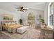 Inviting main bedroom featuring a vaulted ceiling, large arched window, and ample natural light at 2511 Old Pond Dr, Lincolnton, NC 28092