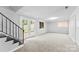 Finished basement with carpet, French doors, and stairs at 3327 Deerwood Dr, Gastonia, NC 28054