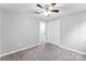 Bright bedroom featuring ceiling fan and double door closet at 3327 Deerwood Dr, Gastonia, NC 28054