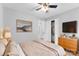 Serene bedroom, neutral tones, ceiling fan and dresser at 3327 Deerwood Dr, Gastonia, NC 28054