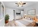 Bedroom with light walls, ceiling fan, and wood floors at 3327 Deerwood Dr, Gastonia, NC 28054