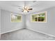 Well-lit bedroom with neutral walls, ceiling fan and plush carpeting at 3327 Deerwood Dr, Gastonia, NC 28054