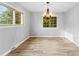 Simple dining room with hardwood floors and chandelier at 3327 Deerwood Dr, Gastonia, NC 28054
