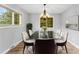Elegant dining room with glass table and chandelier at 3327 Deerwood Dr, Gastonia, NC 28054